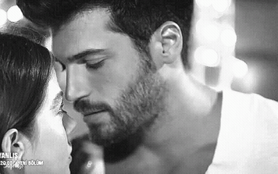 It Is A Black And White Photo Of A Man And Woman Kissing . GIF
