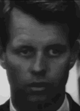 It Is A Black And White Photo Of A Man 'S Face . GIF
