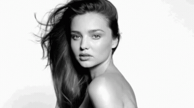 It Is A Black And White Photo Of A Naked Woman With Long Hair . GIF