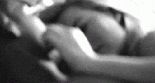 It Is A Black And White Photo Of A Person Laying Down . GIF