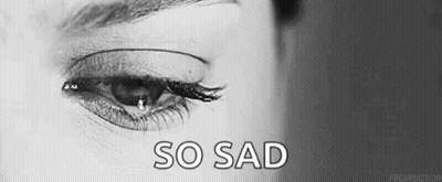 It Is A Black And White Photo Of A Woman 'S Eye With A Tear Coming Out Of It . GIF
