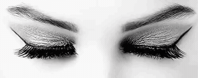 It Is A Black And White Photo Of A Woman 'S Eyes With Long Eyelashes . GIF
