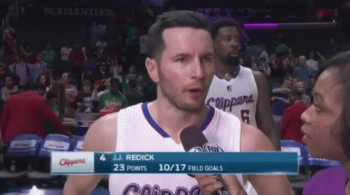 J.j. Reddick Is Being Interviewed By A Reporter During A Basketball Game GIF