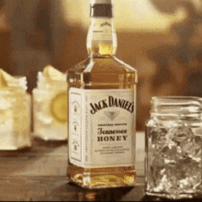 Jack Daniel's Tennessee Honey Bottle On Table GIF