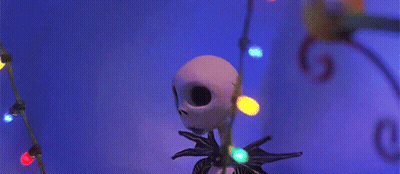 Jack Skellington From The Nightmare Before Christmas Has A String Of Christmas Lights Around His Neck GIF