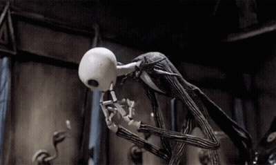 Jack Skellington From The Nightmare Before Christmas Is Standing In A Dark Room With His Mouth Open . GIF