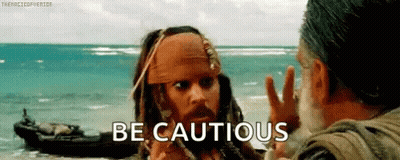 Jack Sparrow From Pirates Of The Caribbean Is Talking To Another Man On The Beach While A Boat Is In The Background . GIF