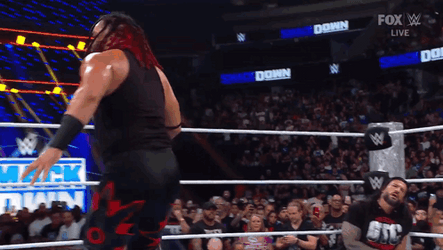 Jacob Fatu Hitting Roman Reigns At Corner GIF