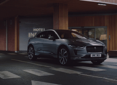 Jaguar Car Parked In Front Of Hotel GIF