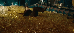 James Franco Sliding Through Gold Coins GIF