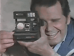 James Garner Using Polaroid Camera GIF