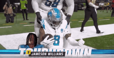 Jameson Williams Holding Football GIF