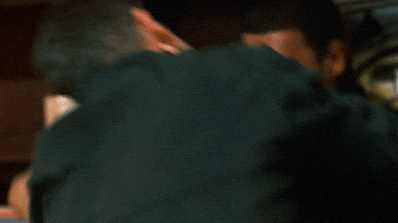 Jason Bourne Holding A Book While Attacking GIF