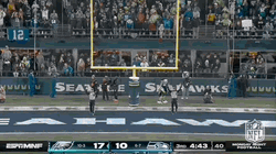 Jason Kelce Sitting While Talking To Teammate GIF