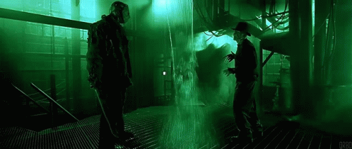 Jason Voorhees And Freddy Krueger Are Standing Next To Each Other In A Dark Room With A Green Light Behind Them . GIF