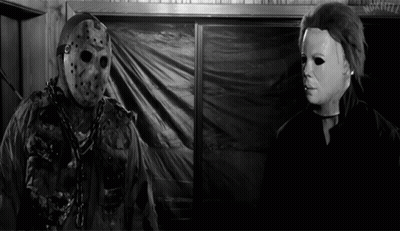 Jason Voorhees And Michael Myers Are In A Black And White Photo GIF