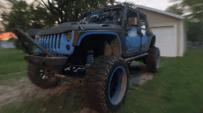 Jeep Parked In Front Of Garage GIF