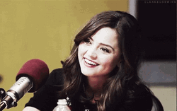 Jenna Coleman Smiling Infront Of Microphone
