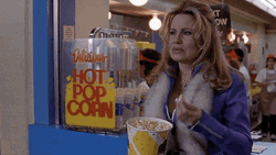 Jennifer Coolidge Holding A Bucket Of Popcorn GIF