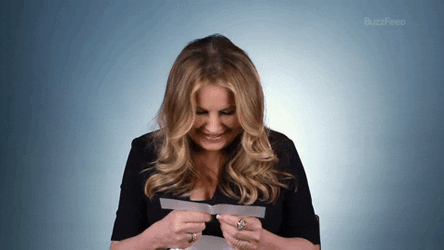 Jennifer Coolidge Laughing While Reading Messages GIF