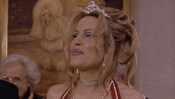 Jennifer Coolidge Wearing A Tiara And Nodding GIF