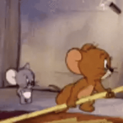 Jerry and Mouse Standing Next to Each Other