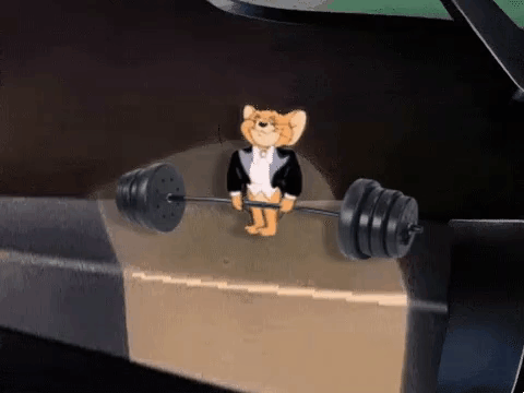 Jerry From Tom And Jerry Is Holding A Barbell On A Box . GIF