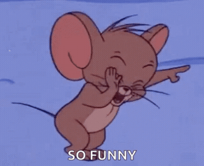 Jerry From Tom And Jerry Is Laughing And Pointing At The Camera . GIF