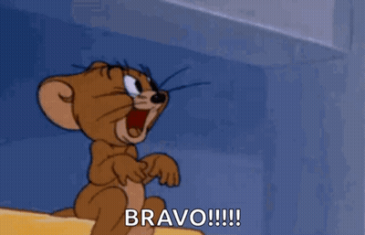Jerry From Tom And Jerry Is Sitting On A Ledge With His Mouth Open And Shouting Bravo !!! GIF