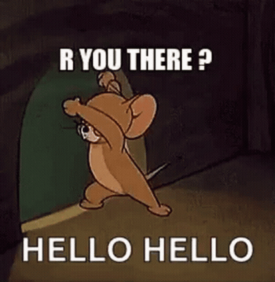 Jerry From Tom And Jerry Is Standing In A Doorway . GIF