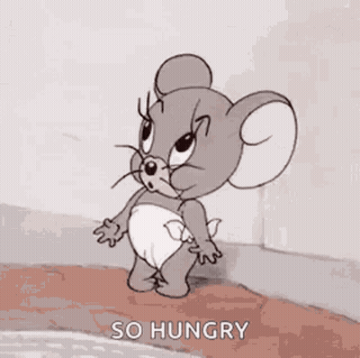 Jerry From Tom And Jerry Is Wearing A Diaper And Yawning With His Mouth Open . GIF