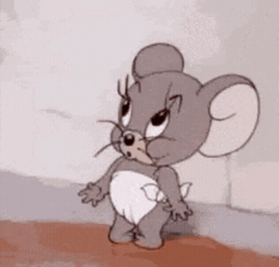 Jerry From Tom And Jerry Standing Next To Wall GIF
