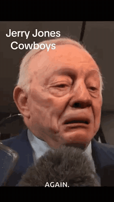 Jerry Jones Crying Into Microphone In Suit And Tie GIF