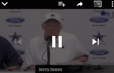 Jerry Jones Is Talking Into A Microphone In Front Of A Ford Logo GIF