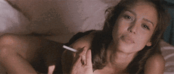 Jessica Alba Holding Cigarette While Lying In Bed GIF