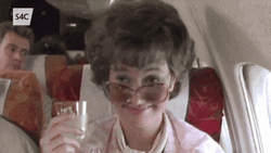 Jessica Lange Holding Prosecco Waving GIF