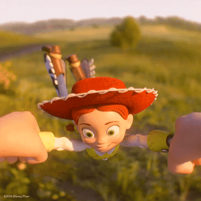 Jessie From Toy Story Held By Two Hands GIF