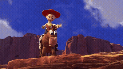 Jessie From Toy Story Is Riding A Horse In The Desert GIF