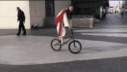 Jesus Christ Costume Riding Bicycle