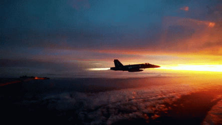 Jet Flying Over Sunset Sky GIF