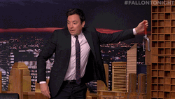Jimmy Fallon Pushing Dominos Falling GIF