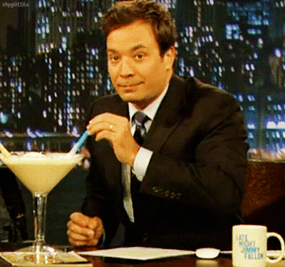 Jimmy Fallon Sitting At Table With Martini Glass GIF