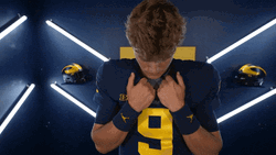 Jj Mccarthy Holding His Shirt Neckline GIF