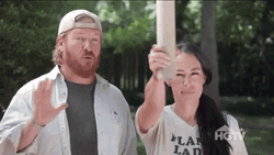 Joanna Gaines Looking Through Rolled Papers