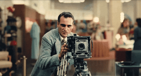 Joaquin Phoenix Snapping Picture On Vintage Camera GIF