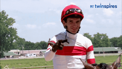 Jockey In Red And White Striped Shirt Pointing GIF