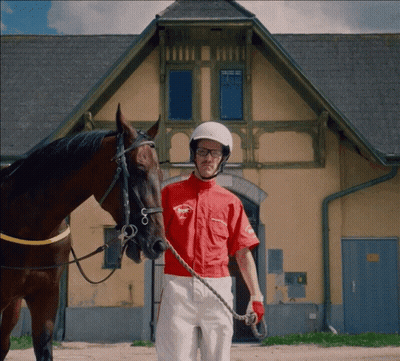 Jockey Next To Horse Wearing Racing Shirt GIF