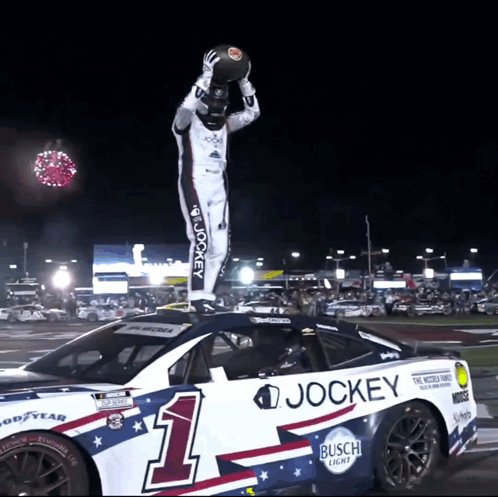 Jockey Race Car With Man Standing On Top GIF