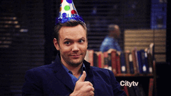 Joel McHale Wearing Birthday Hat GIF