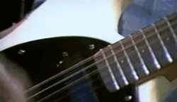 Joey Ramon Ramone Plays Electric Guitar Zoom Out GIF